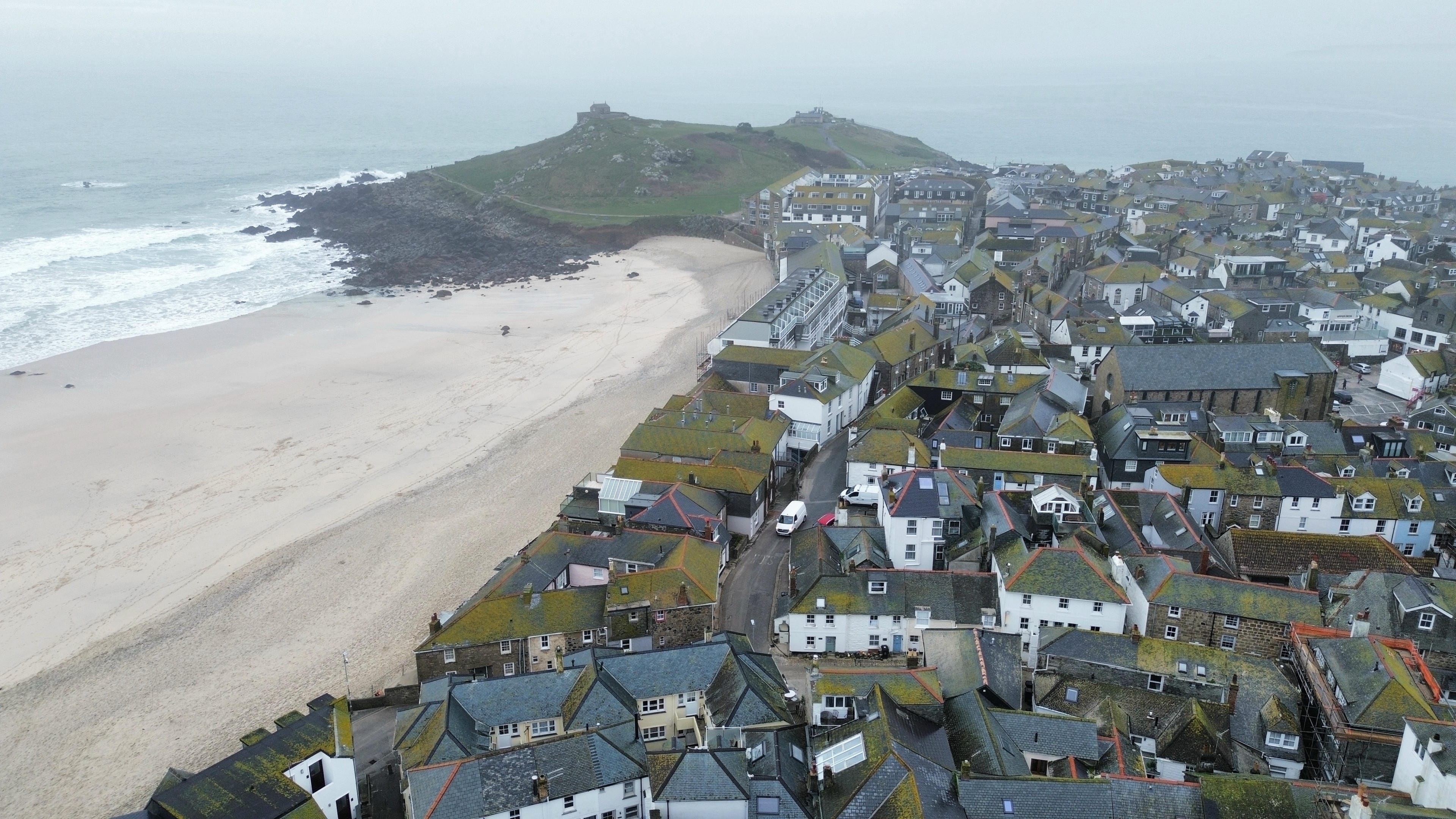 Aerial drone view of a residential rooftop inspection by TDV Surveying